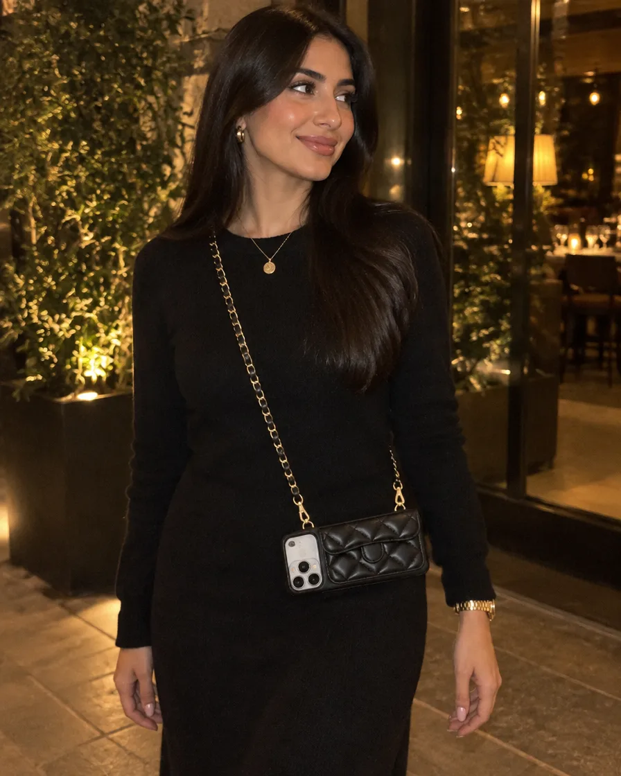 Midnight Black phone purse with a short pocket worn crossbody on a black evening dress